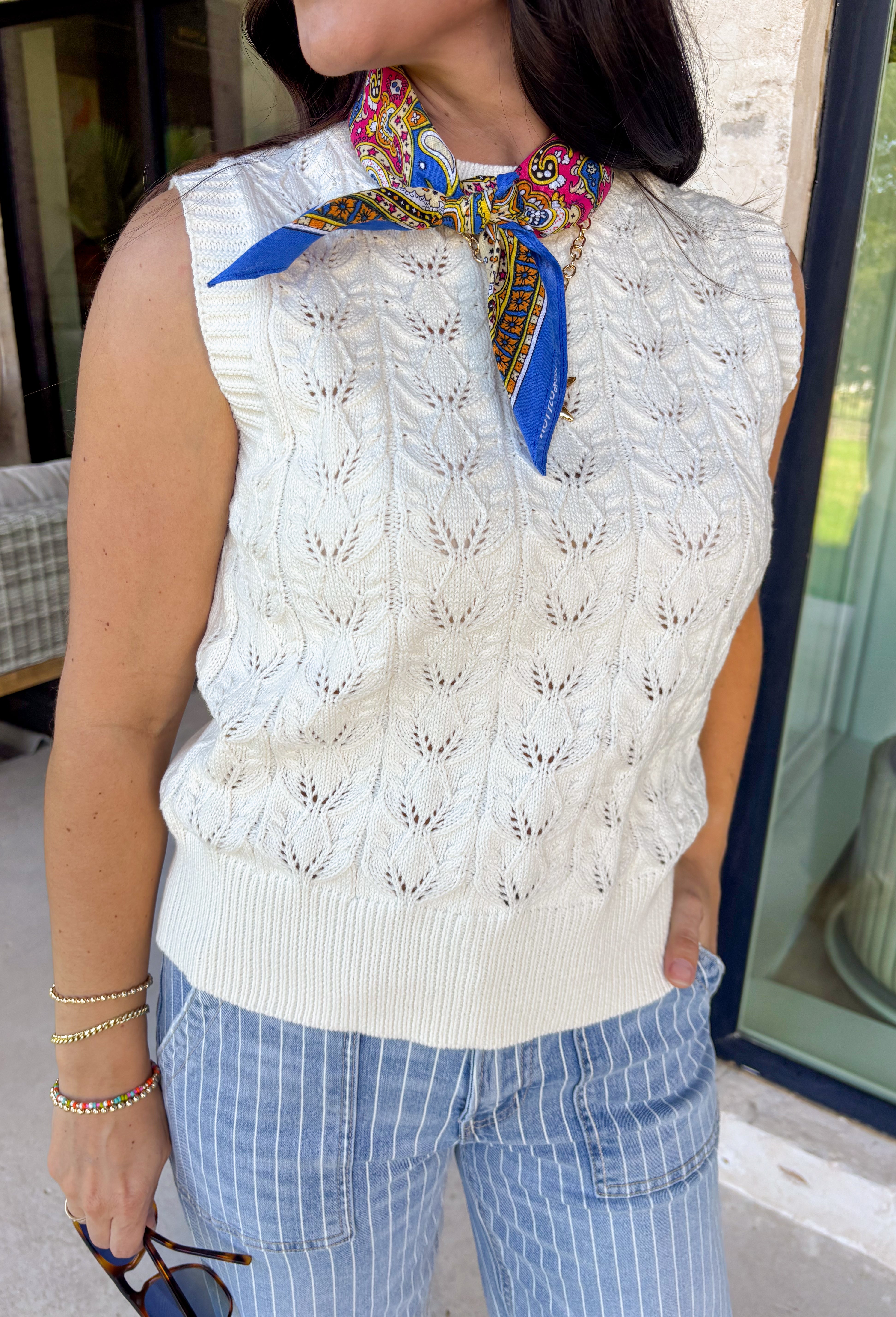 Light, effortless, and perfect for spring layering, this cream textured sweater tank by Entro is a warm-weather staple you’ll reach for again and again. The soft knit texture adds just the right amount of interest while keeping the look simple and polished. Easy to wear on its own or layered under a jacket or cardigan, this piece transitions seamlessly from casual days to dressed-up moments.
