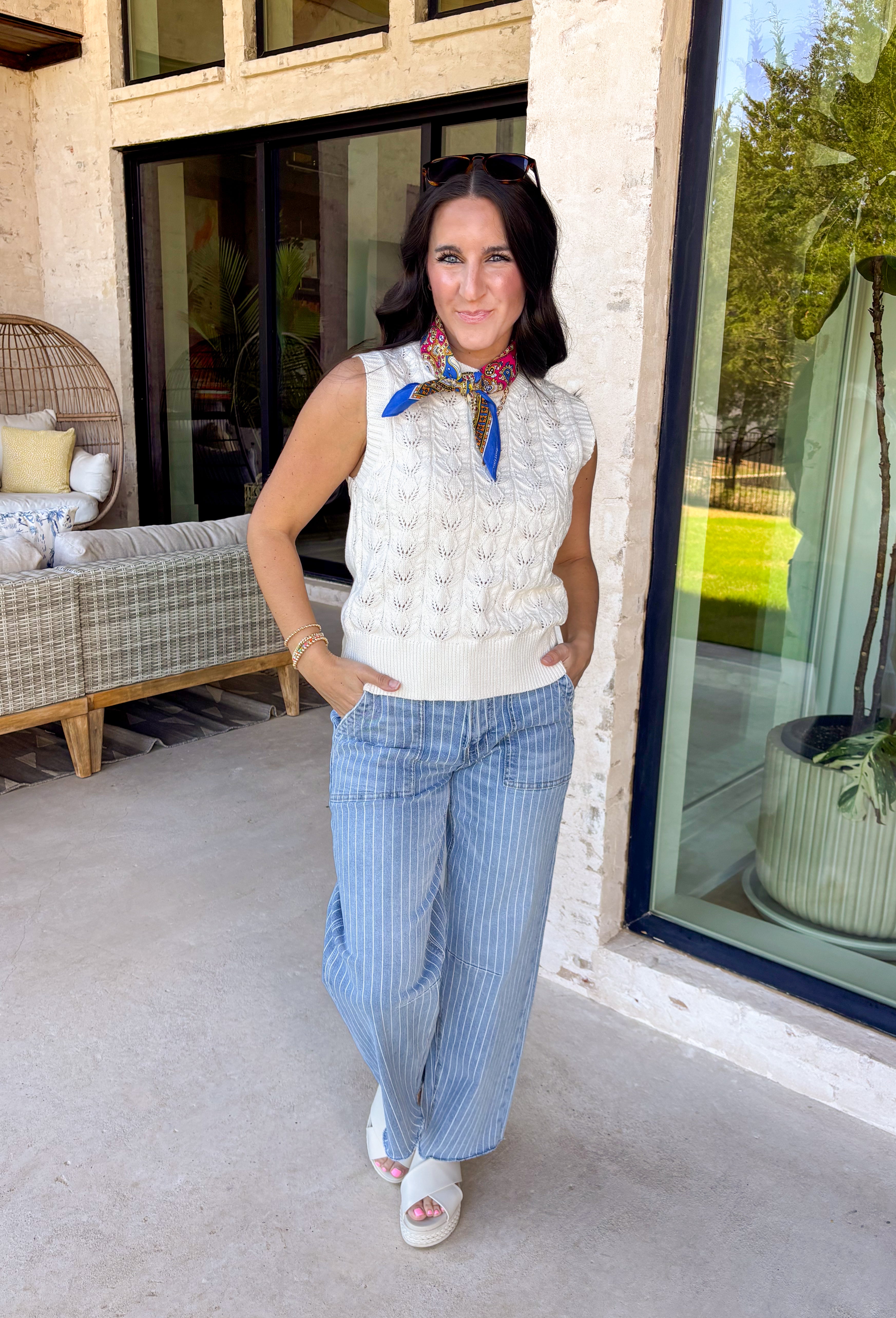 Light, effortless, and perfect for spring layering, this cream textured sweater tank by Entro is a warm-weather staple you’ll reach for again and again. The soft knit texture adds just the right amount of interest while keeping the look simple and polished. Easy to wear on its own or layered under a jacket or cardigan, this piece transitions seamlessly from casual days to dressed-up moments.