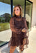 Turn up the print with this leopard dress from Entro, made for days when your outfit deserves a little extra personality. The classic leopard pattern pairs with a mock neckline for a put-together look, while the self-tie detail at the back adds a pretty finishing touch. Long balloon sleeves create soft volume and are finished with elastic cuffs for a comfortable fit. A playful ruffle hem adds movement to the shorter silhouette, and the lined design provides coverage beneath the semi-sheer woven fabric.