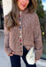 Cozy meets classic in this brown and taupe mini chevron knit cardigan by &Merci. The playful chevron pattern gives this sweater a fun, vintage-inspired feel, while the colorful button-down front adds an unexpected pop of personality. Designed with a mock neckline and a soft, cozy knit texture, it’s perfect for keeping warm when the temperatures start to drop. The classic brown and taupe color combination makes it an easy choice for winter days, holiday outings, and casual weekends. 