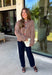 Cozy meets classic in this brown and taupe mini chevron knit cardigan by &Merci. The playful chevron pattern gives this sweater a fun, vintage-inspired feel, while the colorful button-down front adds an unexpected pop of personality. Designed with a mock neckline and a soft, cozy knit texture, it’s perfect for keeping warm when the temperatures start to drop. The classic brown and taupe color combination makes it an easy choice for winter days, holiday outings, and casual weekends. 
