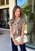 Give your sweater lineup a little wild side with this neutral leopard print top from Entro. The soft knit fabric and classic neutral shades make the statement print surprisingly easy to work into your everyday wardrobe. A coordinating self-tie scarf adds a fun, unexpected detail at the neckline and gives this sweater a little something extra. Short sleeves make it a great transitional piece, while the round neckline and ribbed hem keep the silhouette classic and easy to wear. 