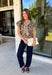 Give your sweater lineup a little wild side with this neutral leopard print top from Entro. The soft knit fabric and classic neutral shades make the statement print surprisingly easy to work into your everyday wardrobe. A coordinating self-tie scarf adds a fun, unexpected detail at the neckline and gives this sweater a little something extra. Short sleeves make it a great transitional piece, while the round neckline and ribbed hem keep the silhouette classic and easy to wear. 