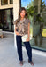 Give your sweater lineup a little wild side with this neutral leopard print top from Entro. The soft knit fabric and classic neutral shades make the statement print surprisingly easy to work into your everyday wardrobe. A coordinating self-tie scarf adds a fun, unexpected detail at the neckline and gives this sweater a little something extra. Short sleeves make it a great transitional piece, while the round neckline and ribbed hem keep the silhouette classic and easy to wear. 