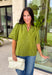 Classic details and rich autumn color come together beautifully in this effortlessly feminine blouse. Designed in a gorgeous olive green hue, this top features delicate embroidery that adds texture and timeless charm without overwhelming the look. The split neckline and puff sleeves create an elevated silhouette, while the scalloped trim along the hem and sleeve openings adds a sweet finishing touch. 