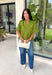 Classic details and rich autumn color come together beautifully in this effortlessly feminine blouse. Designed in a gorgeous olive green hue, this top features delicate embroidery that adds texture and timeless charm without overwhelming the look. The split neckline and puff sleeves create an elevated silhouette, while the scalloped trim along the hem and sleeve openings adds a sweet finishing touch. 