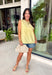 A little texture goes a long way! This sleeveless butter yellow top by Fate combines soft cotton with airy mesh and delicate appliqué details for a unique, elevated twist on a classic top. Lightweight, breathable, and endlessly versatile, it’s the perfect piece to dress up or down, making it a year-round favorite.