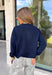 Wrap yourself in cozy comfort with this timeless button-down cardigan from W. Studio. Designed in a rich navy hue, this ultra-soft knit is the perfect layering piece for crisp fall days and cozy evenings. The classic button-front design makes it easy to wear open over your favorite basics or buttoned up as a sweater, while the plush knit blend offers warmth without feeling bulky. 