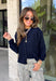 Wrap yourself in cozy comfort with this timeless button-down cardigan from W. Studio. Designed in a rich navy hue, this ultra-soft knit is the perfect layering piece for crisp fall days and cozy evenings. The classic button-front design makes it easy to wear open over your favorite basics or buttoned up as a sweater, while the plush knit blend offers warmth without feeling bulky. 