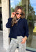 Wrap yourself in cozy comfort with this timeless button-down cardigan from W. Studio. Designed in a rich navy hue, this ultra-soft knit is the perfect layering piece for crisp fall days and cozy evenings. The classic button-front design makes it easy to wear open over your favorite basics or buttoned up as a sweater, while the plush knit blend offers warmth without feeling bulky. 