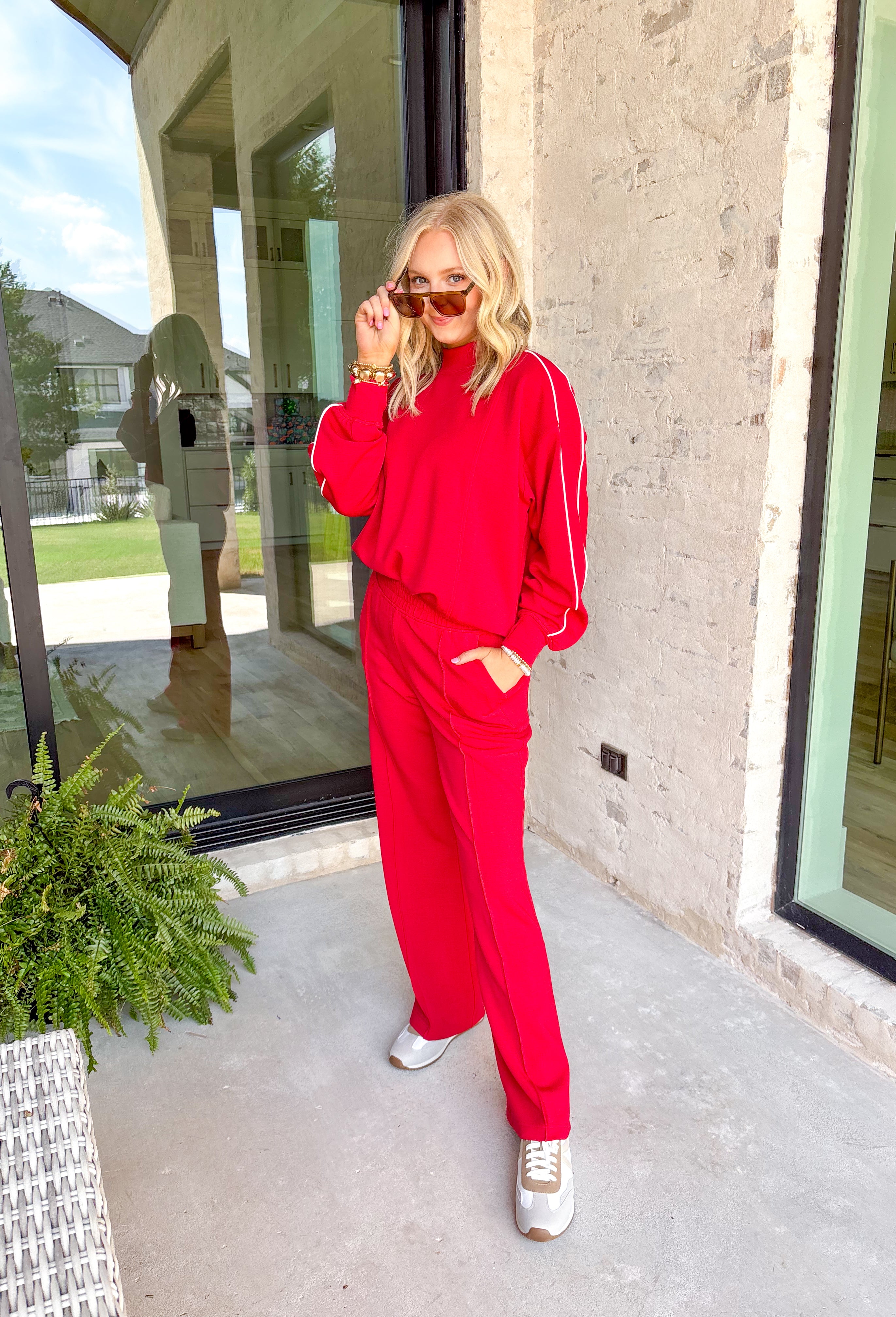 Laid-back comfort meets bold style in these red wide leg pants. Designed with a seam down the front for a flattering touch, they feature an easy elastic waistband that keeps the fit relaxed yet polished. Cozy in a soft modal-blend fabric, these pants are perfect for lounging, running errands, or styling up for a night out. Pair with the matching Point Taken Pullover in Red to wear as a set, or mix and match with your favorite tops for endless outfit possibilities.