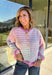 Bring a little extra color to cozy season with this striped knit cardigan from Twenitfourth. A playful mix of pink, purple, coral, blue, lavender, and off white gives this sweater a cheerful look that instantly brightens up cooler days. The button-down front makes it easy to wear closed as a top or open over your favorite tee or tank for a layered look.