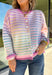 Bring a little extra color to cozy season with this striped knit cardigan from Twenitfourth. A playful mix of pink, purple, coral, blue, lavender, and off white gives this sweater a cheerful look that instantly brightens up cooler days. The button-down front makes it easy to wear closed as a top or open over your favorite tee or tank for a layered look.