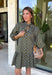 Unexpected color makes this floral dress from Entro such a fun pick for the season. The olive green background is covered in an abstract periwinkle floral print, creating a pretty mix of earthy and cool tones that stands out from traditional fall florals. A shirt collar and self-tie neckline add extra detail, while the button-front closure and ¾ puff sleeves give the silhouette a classic feel. The ruffle hem adds a playful finish, and the lined design provides comfortable coverage.