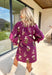 This plum floral dress is giving fall garden party—but make it chic The soft long sleeves are finished with a playful elastic ruffle, while the neutral floral print pops with dreamy shades of cream, pink, and olive. A contrasting trim along the top adds just the right amount of detail. Lined for comfort and style, it’s the kind of dress that goes from pumpkin patch strolls to dinner dates without missing a beat.