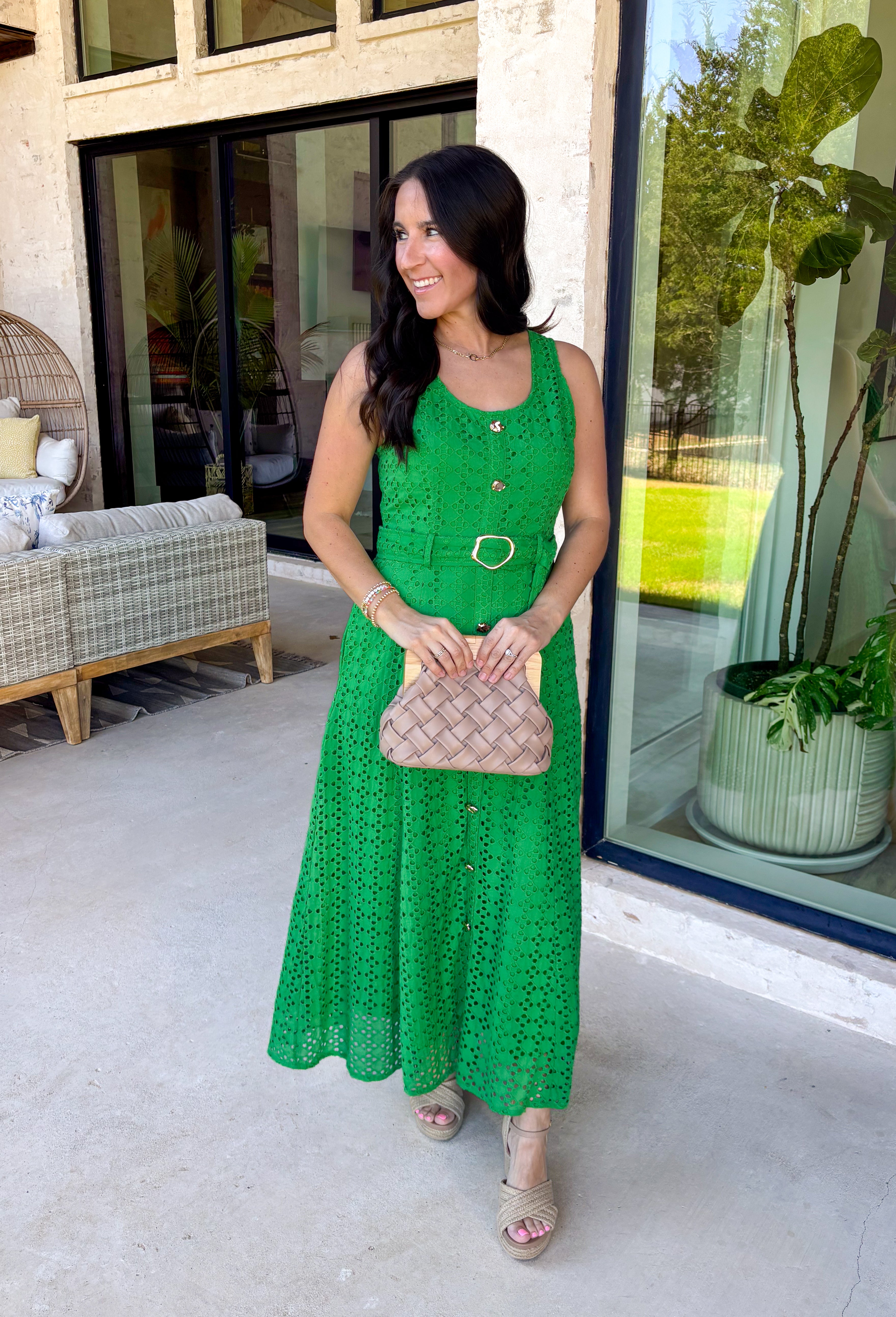 Bold, polished, and beautifully detailed — this kelly green eyelet lace midi dress is a true standout. The intricate eyelet lace gives it texture and dimension, while the gold textured button-down front adds a hint of shine that elevates the entire look. Designed with a matching belt featuring a gold buckle, this dress cinches the waist for a flattering, feminine silhouette. Smocking along the back provides comfortable stretch, and the back zipper closure keeps the fit secure and streamlined. 