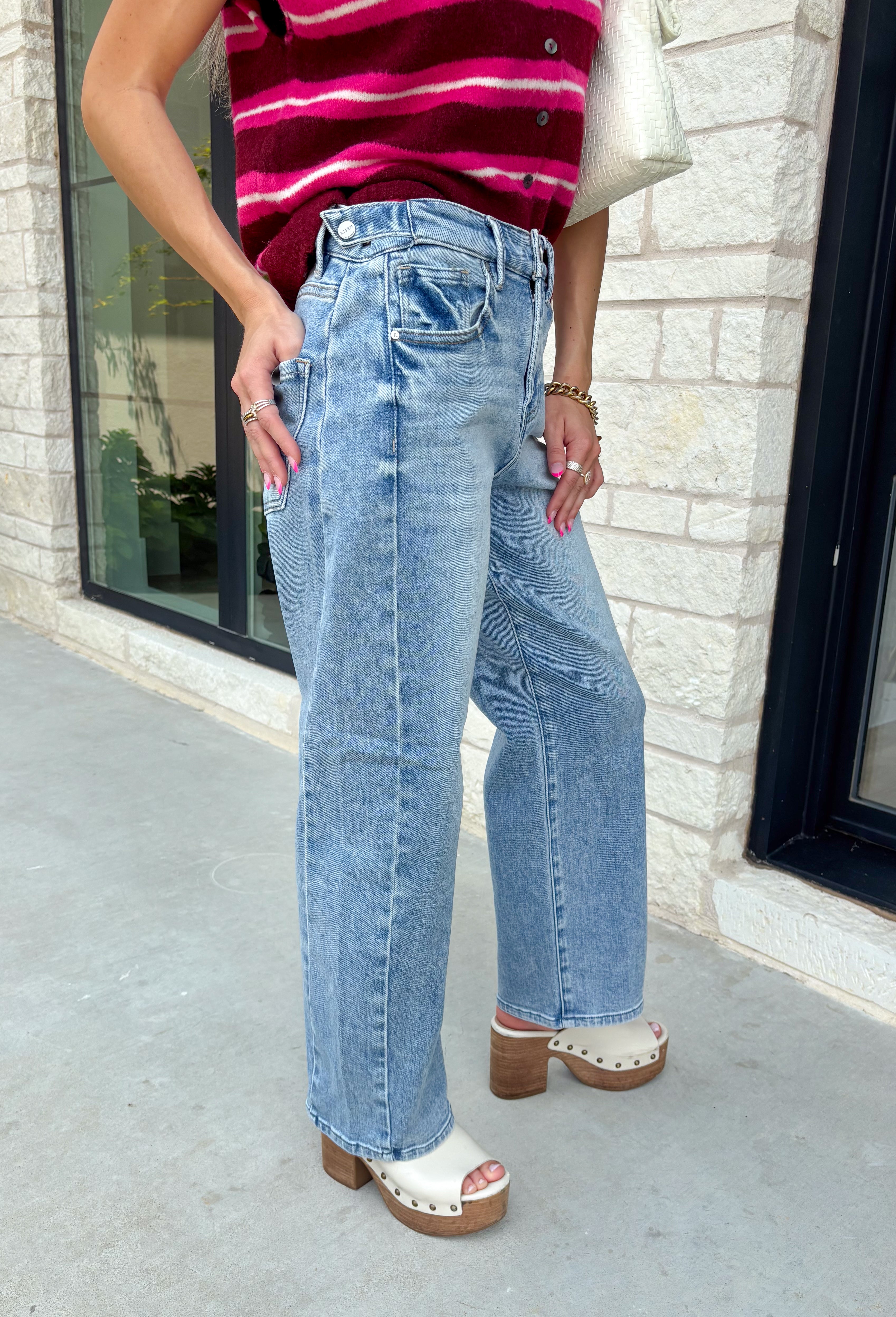 Meet the denim you'll be reaching for on repeat. These light wash barrel jeans combine a modern silhouette with everyday comfort, making them an easy staple for every season. Designed with a flattering high-rise fit and an on-trend cropped barrel leg, they offer a relaxed yet polished look that pairs effortlessly with everything from cozy sweaters to your favorite graphic tees. The innovative hidden adjustable waistband provides a customizable fit you'll appreciate.