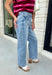 Meet the denim you'll be reaching for on repeat. These light wash barrel jeans combine a modern silhouette with everyday comfort, making them an easy staple for every season. Designed with a flattering high-rise fit and an on-trend cropped barrel leg, they offer a relaxed yet polished look that pairs effortlessly with everything from cozy sweaters to your favorite graphic tees. The innovative hidden adjustable waistband provides a customizable fit you'll appreciate.