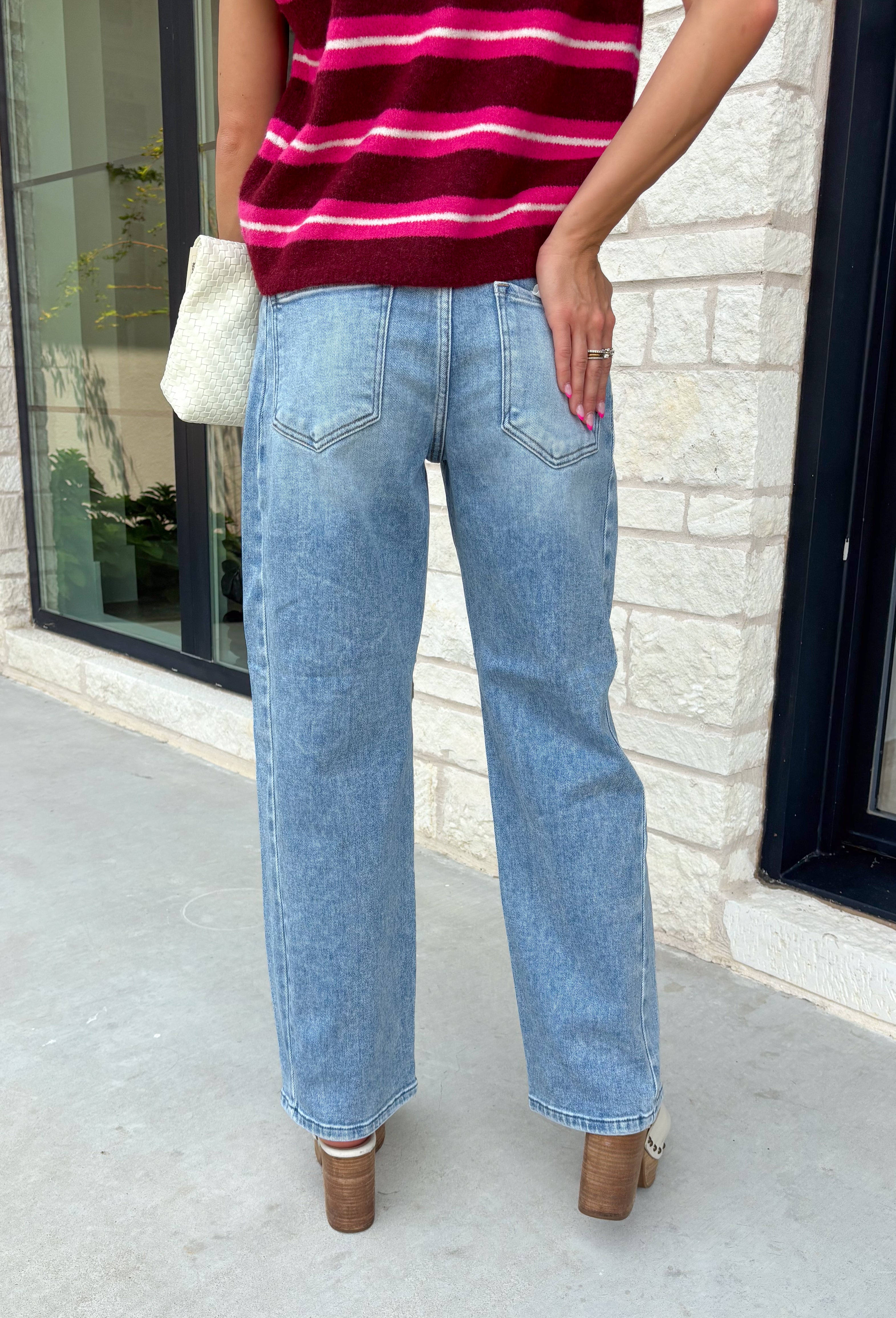 Meet the denim you'll be reaching for on repeat. These light wash barrel jeans combine a modern silhouette with everyday comfort, making them an easy staple for every season. Designed with a flattering high-rise fit and an on-trend cropped barrel leg, they offer a relaxed yet polished look that pairs effortlessly with everything from cozy sweaters to your favorite graphic tees. The innovative hidden adjustable waistband provides a customizable fit you'll appreciate.