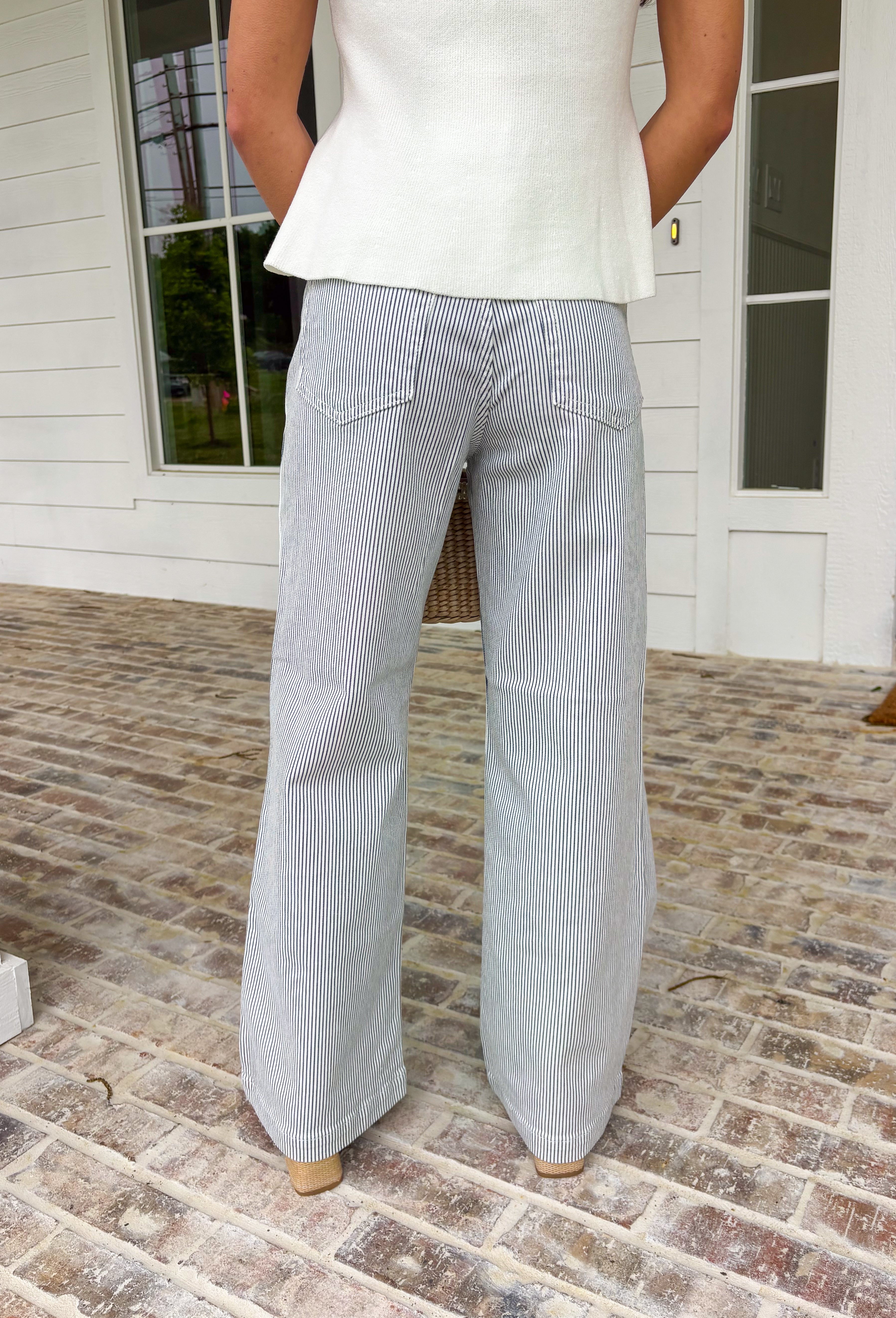 These white wide leg denim jeans with blue stripes are the statement pair your summer wardrobe has been waiting for! The vertical stripe detail gives a lengthening, flattering look while adding a fresh, coastal-inspired vibe. Designed with a comfortable stretch and breezy wide leg fit, they’re perfect for staying cool while still looking put together. Dress them up with a blouse or keep it casual with a tank or tee—either way, they do all the work for you. 