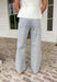 These white wide leg denim jeans with blue stripes are the statement pair your summer wardrobe has been waiting for! The vertical stripe detail gives a lengthening, flattering look while adding a fresh, coastal-inspired vibe. Designed with a comfortable stretch and breezy wide leg fit, they’re perfect for staying cool while still looking put together. Dress them up with a blouse or keep it casual with a tank or tee—either way, they do all the work for you. 