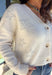 Shine bright this season in this off-white button-down cardigan by Debut. Crafted from a soft, cozy knit, this sweater features delicate pearl star embellishments that add the perfect hint of glam. With its relaxed fit and timeless charm, it’s a dreamy layer for holiday gatherings or casual winter days.