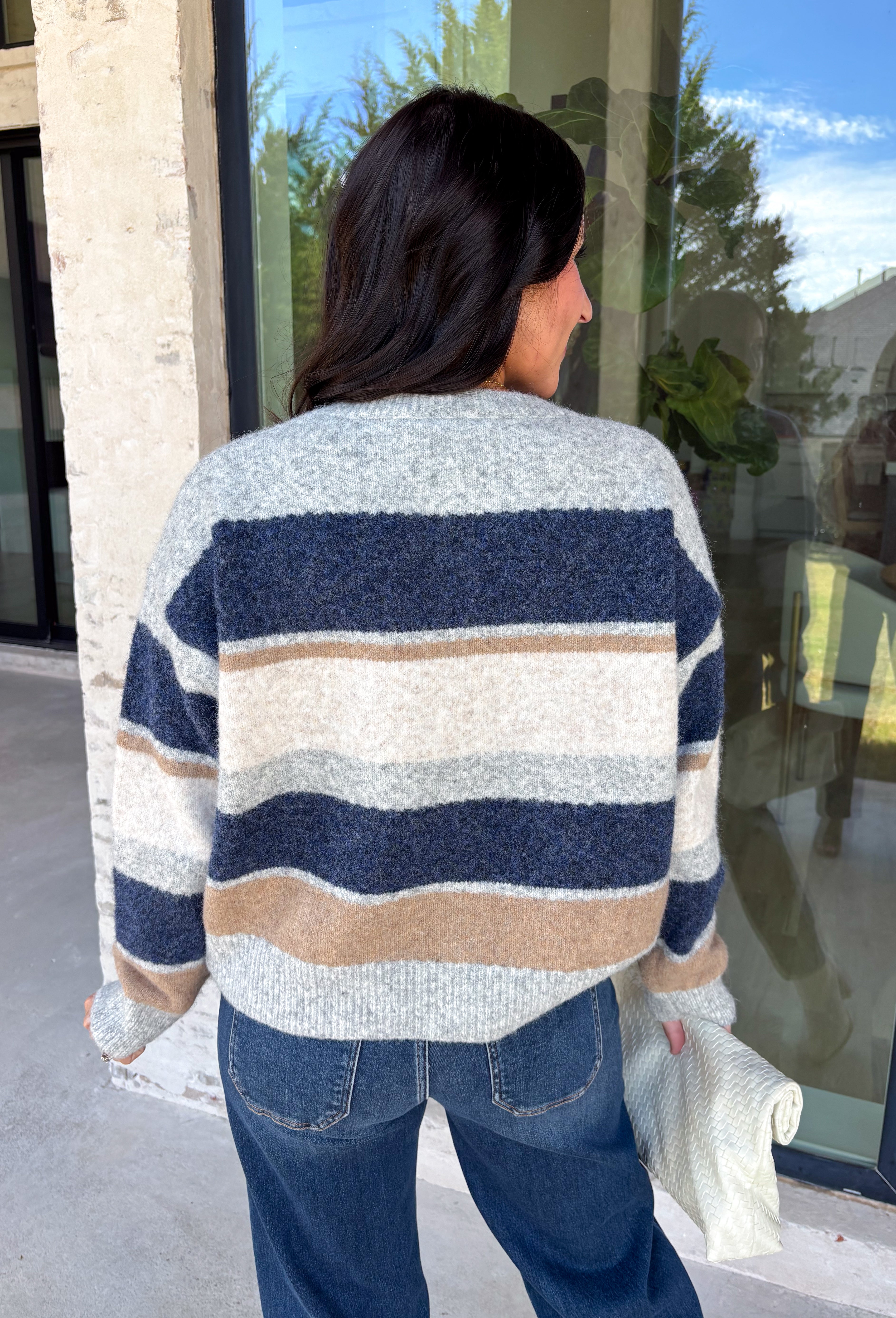 Wrap yourself in cozy comfort with this timeless cardigan from Mable. Designed in a soft gray knit with classic navy, tan, and cream stripes, this sweater is the perfect layering piece for crisp fall days. The button-front design makes it easy to wear open or closed, while the ribbed neckline, hem, and cuffs add a polished finishing touch. Crafted from an ultra-soft knit blend, this cardigan is perfect for everything from relaxing weekends to coffee dates and casual workdays.