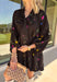 Feminine, chic, and full of seasonal charm, this floral dress is the perfect piece for all your favorite fall occasions. Featuring a classic black backdrop with a vibrant colorful floral print, this dress offers a timeless silhouette with eye-catching details. The flattering v-neckline is accented by a beautiful scarf tie that adds a polished, sophisticated touch, while the self-tie waist creates a customizable fit you'll love. 