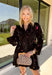 Feminine, chic, and full of seasonal charm, this floral dress is the perfect piece for all your favorite fall occasions. Featuring a classic black backdrop with a vibrant colorful floral print, this dress offers a timeless silhouette with eye-catching details. The flattering v-neckline is accented by a beautiful scarf tie that adds a polished, sophisticated touch, while the self-tie waist creates a customizable fit you'll love. 