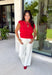 Say hello to your new fall favorite! This rich red short sleeve top brings all the cozy seasonal charm with its tiered peplum silhouette and delicate shirred detailing throughout. The lightweight, textured cotton makes it comfortable enough for those warmer autumn afternoons, while the cropped length and elastic hem create a flattering shape that pairs perfectly with your favorite high-rise denim. 