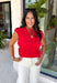 Say hello to your new fall favorite! This rich red short sleeve top brings all the cozy seasonal charm with its tiered peplum silhouette and delicate shirred detailing throughout. The lightweight, textured cotton makes it comfortable enough for those warmer autumn afternoons, while the cropped length and elastic hem create a flattering shape that pairs perfectly with your favorite high-rise denim. 