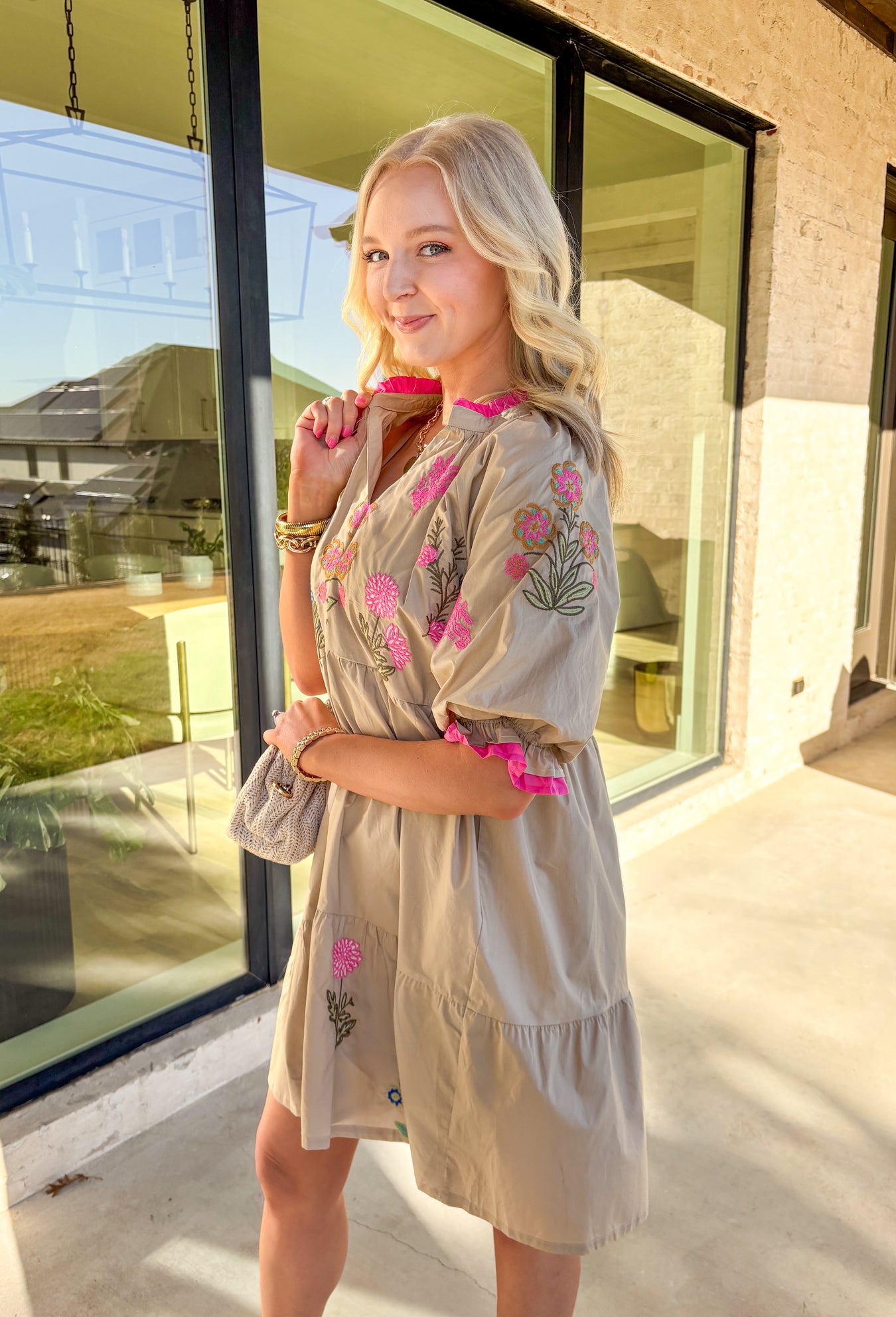 Soft, sweet, and full of spring charm, this taupe short sleeve dress by Umgee is a warm-weather favorite. Featuring colorful floral embroidery in pink, blue, green, and mustard, this dress brings a playful pop of color to an easy, feminine silhouette. The ruffled neckline and elastic ruffle sleeves add a romantic touch, making it perfect for brunch dates, church, or sunny days out and about.