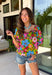 This green floral top is bursting with color and made for sunny summer days! Featuring a vibrant floral print in shades of pink, red, yellow, and blue, it instantly brightens up any outfit. The square neckline gives it a flattering, feminine feel, while the puff sleeves add just the right amount of charm. Finished with a sweet tie detail in the back, this lightweight cotton top is perfect for everything from brunch dates to weekend getaways. 