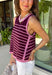 This striped sleeveless sweater is the perfect way to welcome sweater weather! Featuring rich burgundy and pink stripes, it captures all the cozy charm of the season while remaining lightweight enough for those in-between fall days. The contrast trim adds a polished finish, and the classic round neckline makes it easy to wear on its own or layered under your favorite denim jacket, blazer, or cardigan. 