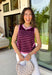 This striped sleeveless sweater is the perfect way to welcome sweater weather! Featuring rich burgundy and pink stripes, it captures all the cozy charm of the season while remaining lightweight enough for those in-between fall days. The contrast trim adds a polished finish, and the classic round neckline makes it easy to wear on its own or layered under your favorite denim jacket, blazer, or cardigan. 