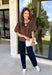 Classic polka dots never go out of style, and this charming top from Day + Moon is the perfect addition to your fall wardrobe. Designed in a rich brown hue with a timeless tan polka dot print, this effortlessly feminine blouse is easy to dress up or down. The puff sleeves add a soft, romantic touch, while the keyhole button closure at the back creates a polished finishing detail. Crafted from breathable cotton, this versatile top is perfect for everything from workdays to weekend outings.