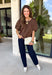 Classic polka dots never go out of style, and this charming top from Day + Moon is the perfect addition to your fall wardrobe. Designed in a rich brown hue with a timeless tan polka dot print, this effortlessly feminine blouse is easy to dress up or down. The puff sleeves add a soft, romantic touch, while the keyhole button closure at the back creates a polished finishing detail. Crafted from breathable cotton, this versatile top is perfect for everything from workdays to weekend outings.