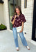 Classic polka dots meet rich fall color in this charming burgundy top! Featuring a soft mauve polka dot print, this top is an effortless way to add personality to your everyday wardrobe. The hidden button front creates a clean, polished look, while the foldover neckline and front pocket add timeless details you'll love. Finished with short puff sleeves, this versatile top is perfect for everything from workdays to weekend brunches and pairs beautifully with your favorite fall denim.