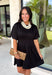 Every wardrobe deserves a little black dress that's as comfortable as it is stylish! This timeless dress is designed with flattering pintuck detailing at the waist to create an effortlessly polished silhouette you'll love. The soft knit fabric offers all-day comfort, while the classic round neckline and side pockets make it an easy choice for everything from workdays to dinner dates and weekend outings. 