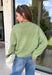 Nothing says cozy season quite like the perfect everyday sweater, and this one from Things Between is sure to become your new favorite. Designed in a matcha hue, this soft knit sweater is effortlessly timeless and easy to style with all your favorite fall pieces. The cozy knit construction offers warmth without feeling bulky, making it perfect for layering on crisp mornings or wearing on its own throughout the season. 