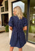 You can never go wrong with classic navy and white polka dots! This dress brings timeless charm with a playful twist. Designed with layered short puff sleeves and elasticated openings, it has just the right amount of volume while staying comfortable and easy to wear. The flattering v-neckline with a collar adds a polished touch, while the elasticated back waist and self-tie detail create a cinched, feminine shape.