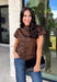 Give your cooler-weather wardrobe a little wild side with this faux suede leopard top from THML. The soft faux suede texture gives the classic animal print a rich seasonal feel that works perfectly as late fall starts turning into winter. A mock neckline adds a polished cold-weather touch, while the short sleeves make it easy to wear on its own or layer underneath a jacket. A keyhole closure at the back finishes the look with a simple detail. 