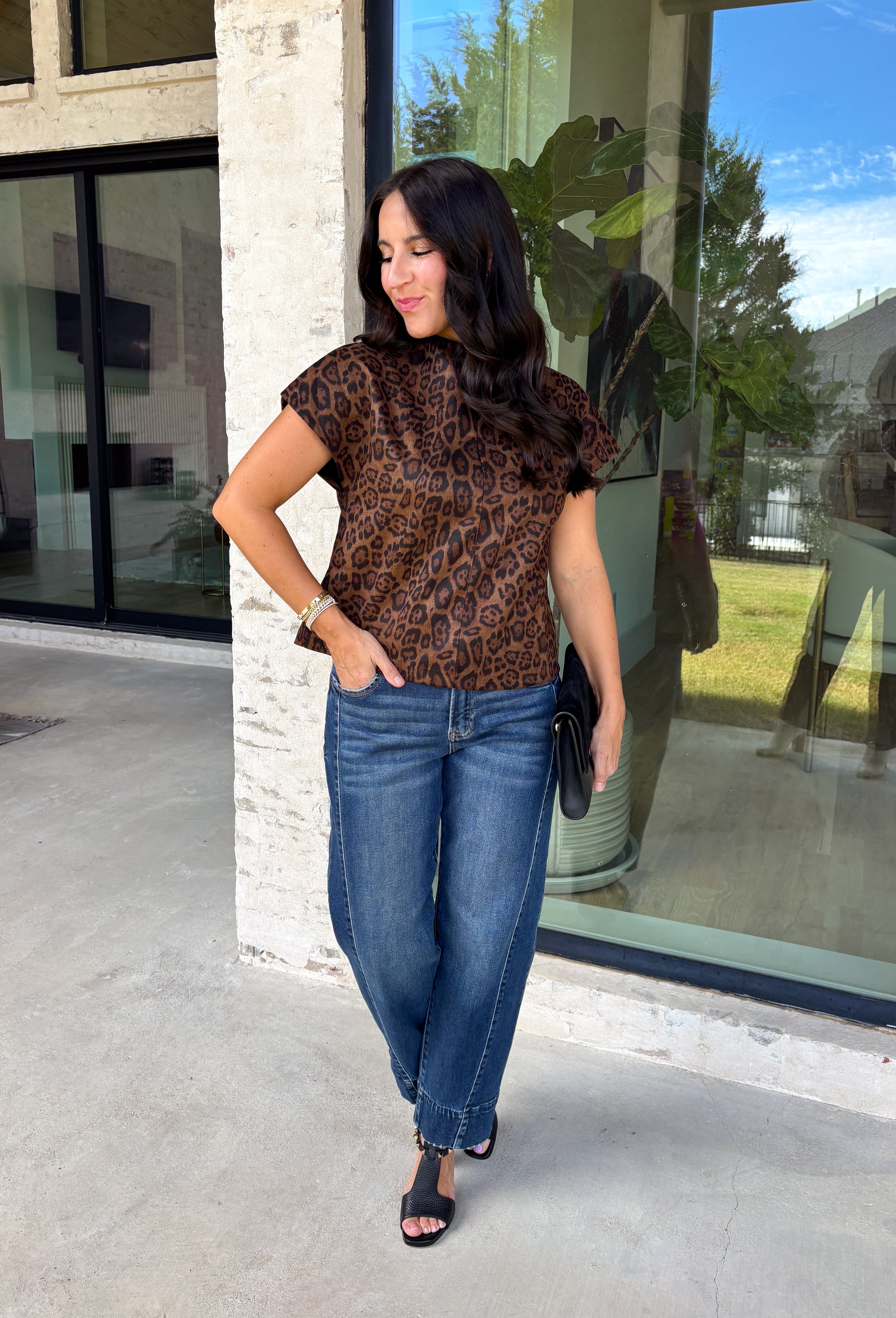 Give your cooler-weather wardrobe a little wild side with this faux suede leopard top from THML. The soft faux suede texture gives the classic animal print a rich seasonal feel that works perfectly as late fall starts turning into winter. A mock neckline adds a polished cold-weather touch, while the short sleeves make it easy to wear on its own or layer underneath a jacket. A keyhole closure at the back finishes the look with a simple detail. 