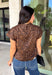 Give your cooler-weather wardrobe a little wild side with this faux suede leopard top from THML. The soft faux suede texture gives the classic animal print a rich seasonal feel that works perfectly as late fall starts turning into winter. A mock neckline adds a polished cold-weather touch, while the short sleeves make it easy to wear on its own or layer underneath a jacket. A keyhole closure at the back finishes the look with a simple detail. 