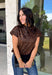 Give your cooler-weather wardrobe a little wild side with this faux suede leopard top from THML. The soft faux suede texture gives the classic animal print a rich seasonal feel that works perfectly as late fall starts turning into winter. A mock neckline adds a polished cold-weather touch, while the short sleeves make it easy to wear on its own or layer underneath a jacket. A keyhole closure at the back finishes the look with a simple detail. 