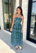 Make a statement this season in this effortlessly beautiful hunter green midi dress! Featuring a light blue abstract print throughout, this strapless silhouette is both timeless and eye-catching. The smocked back bodice offers a comfortable, flattering fit, while the structured zipper closure keeps everything secure. Finished with side pockets and a fully lined design, this cotton midi dress is perfect for fall weddings, dinner dates, and family gatherings.