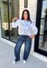 A little western charm and a whole lot of kindness make this sweatshirt an instant favorite! Featuring the playful phrase "Be Rootin', Be Tootin', But Most Of All Be Kind," this heather grey pullover is finished with an abstract illustration of a horse, horseshoe, and stars. The fleece-lined interior keeps you warm and cozy, making it the perfect sweatshirt for everything from weekend errands and football games to bonfires and relaxing at home. 