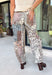 Make room in your denim lineup for these statement-making barrel jeans from Risen. Designed with a neutral mixed paisley print, they bring a vintage-inspired twist to the barrel silhouette you already love. The high-rise fit and cropped length create a flattering shape, while the tie waistband adds an unexpected detail that makes this pair stand out from traditional denim. 