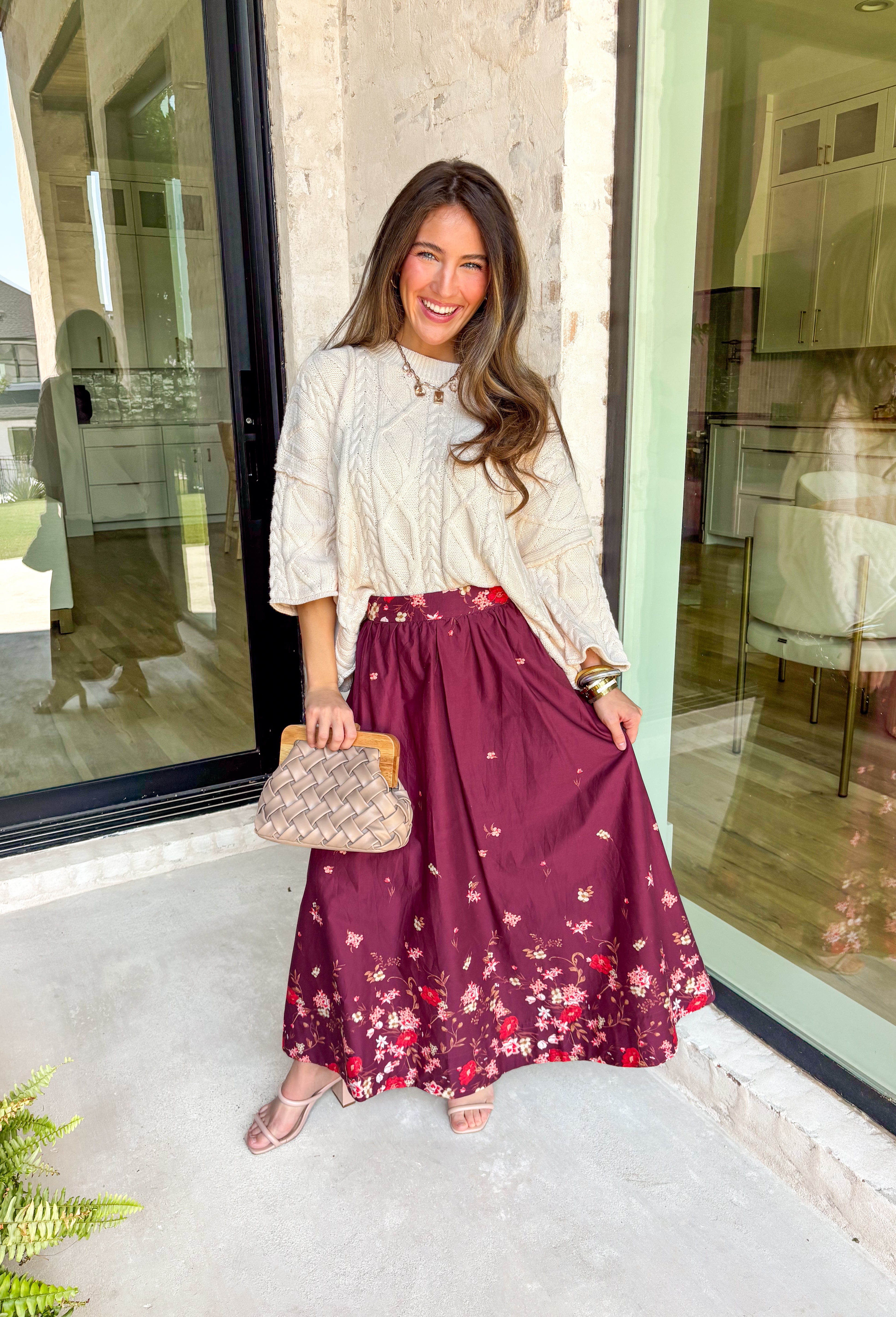 Feminine and flowy, this burgundy midi skirt is a seasonal standout. Designed with a floral border placement print, it adds just the right amount of charm while keeping the look timeless. The elasticated back waistband and side zipper closure make it comfortable and flattering, while side pockets add that everyday practicality we love. Fully lined in breathable cotton, this skirt is ready for everything from workdays to weekend strolls through the pumpkin patch.