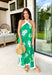 This green floral halter midi dress is such a stunning, easy statement for summer! The blue and cream floral print pops beautifully against the green base, while the contrast cream trim adds a fresh, polished touch. The halter neckline with a self-tie closure gives it that flattering, elevated feel, and the side slits add just the right amount of movement for warm days. Fully lined with side pockets (always a win), it’s perfect for everything from vacation dinners to summer events. 